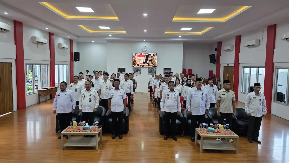 Jajaran Pemkab Bolaang Mongondow Timur dan Kanwil Kemenkum Sulut foto bersama usai penandatanganan kesepakatan pelayanan hukum mediasulut.id